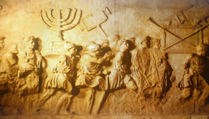 Roman Triumphal arch panel copy from Beth Hatefutsoth, showing spoils of Jerusalem temple. Image by Wikimedia Commons.